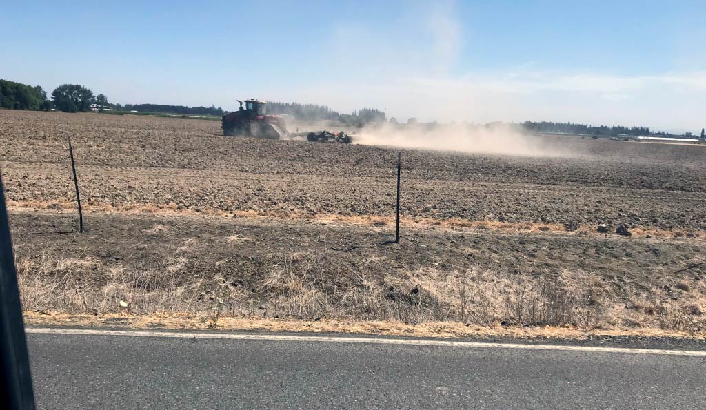 Tractor making dust.