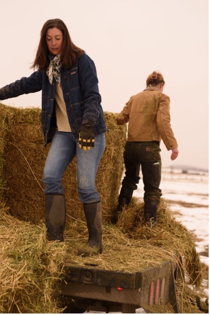 Cory Carman and Mimi Casteel in hay.