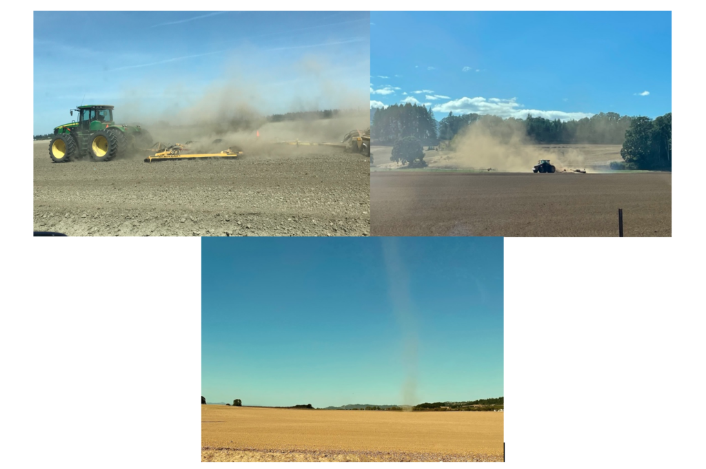 Tractor kicking up dirt.